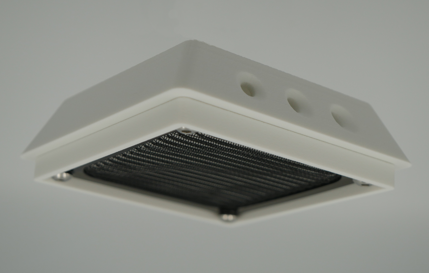 Compact white filtered air vent with black screen for rear mounting on canopies or structures