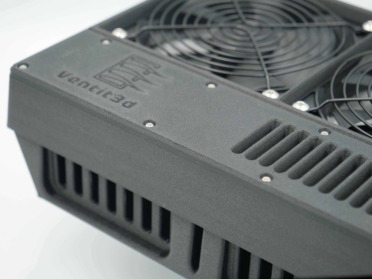 Close-up of the black Ventit3D Dual 120mm 12volt canopy vent showing the embossed logo, twin fan guards and downward louvres