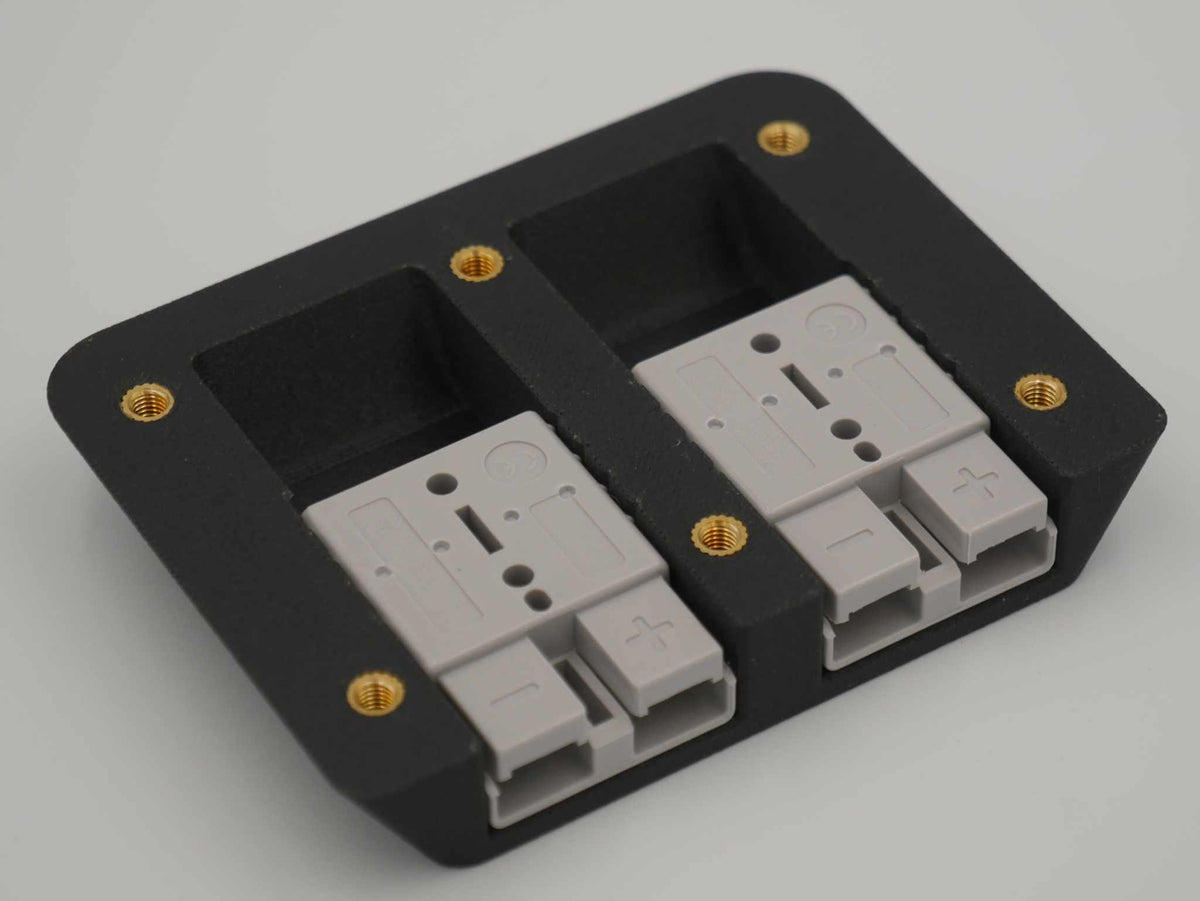 Dual Anderson Mount with two 50amp Anderson plugs in a black ASA-Glass Fibre mounting plate with brass screw inserts for canopy installation
