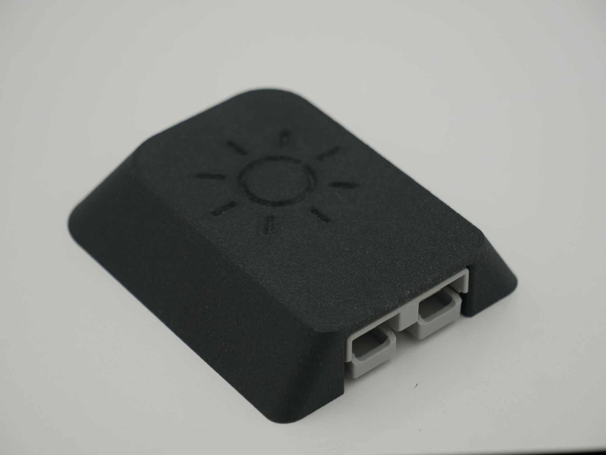 Single Anderson Mount black tough ASA-Glass Fibre housing with sun logo and 50amp Anderson plug on a grey background