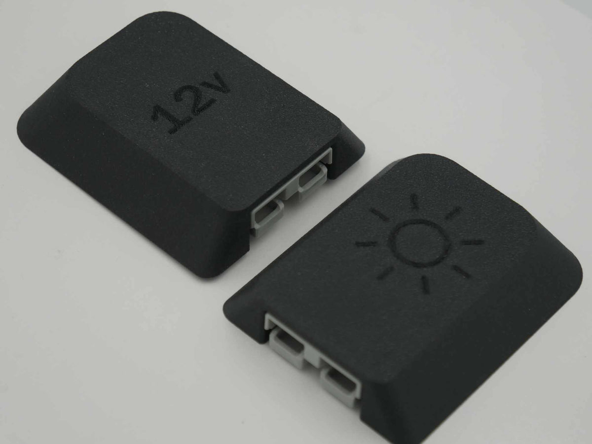 two black Single Anderson Mount 50amp plugs with 12v and sun icons on top, made from durable ASA-Glass Fibre