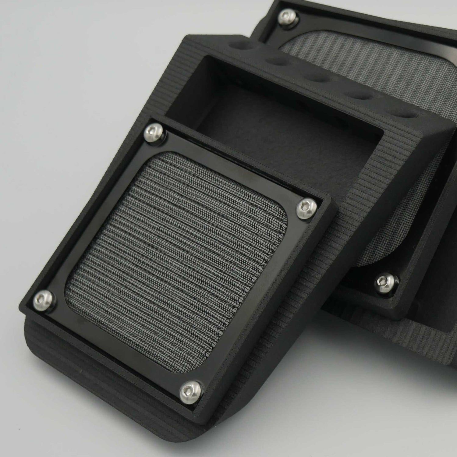 Slanted Mini filtered air vent with black ASA-CF or ABS-GF material, sleek angular design for rear canopy mounting with integrated screen and filter