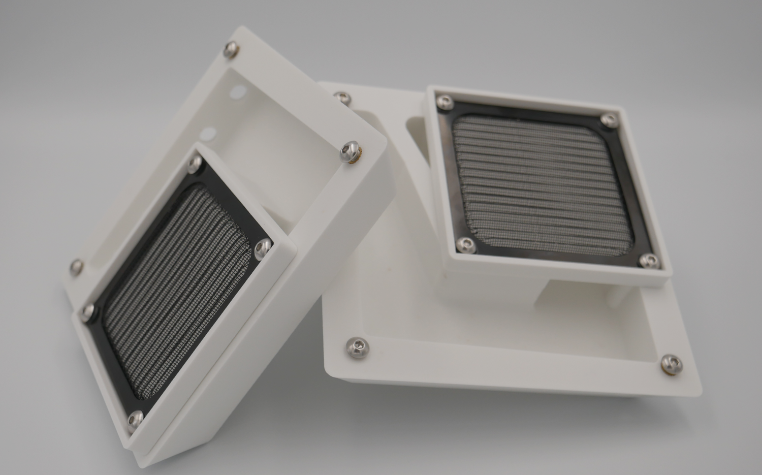 Directional filtered air vent pair in white with mesh screens and mounting brackets for vehicle canopy installation