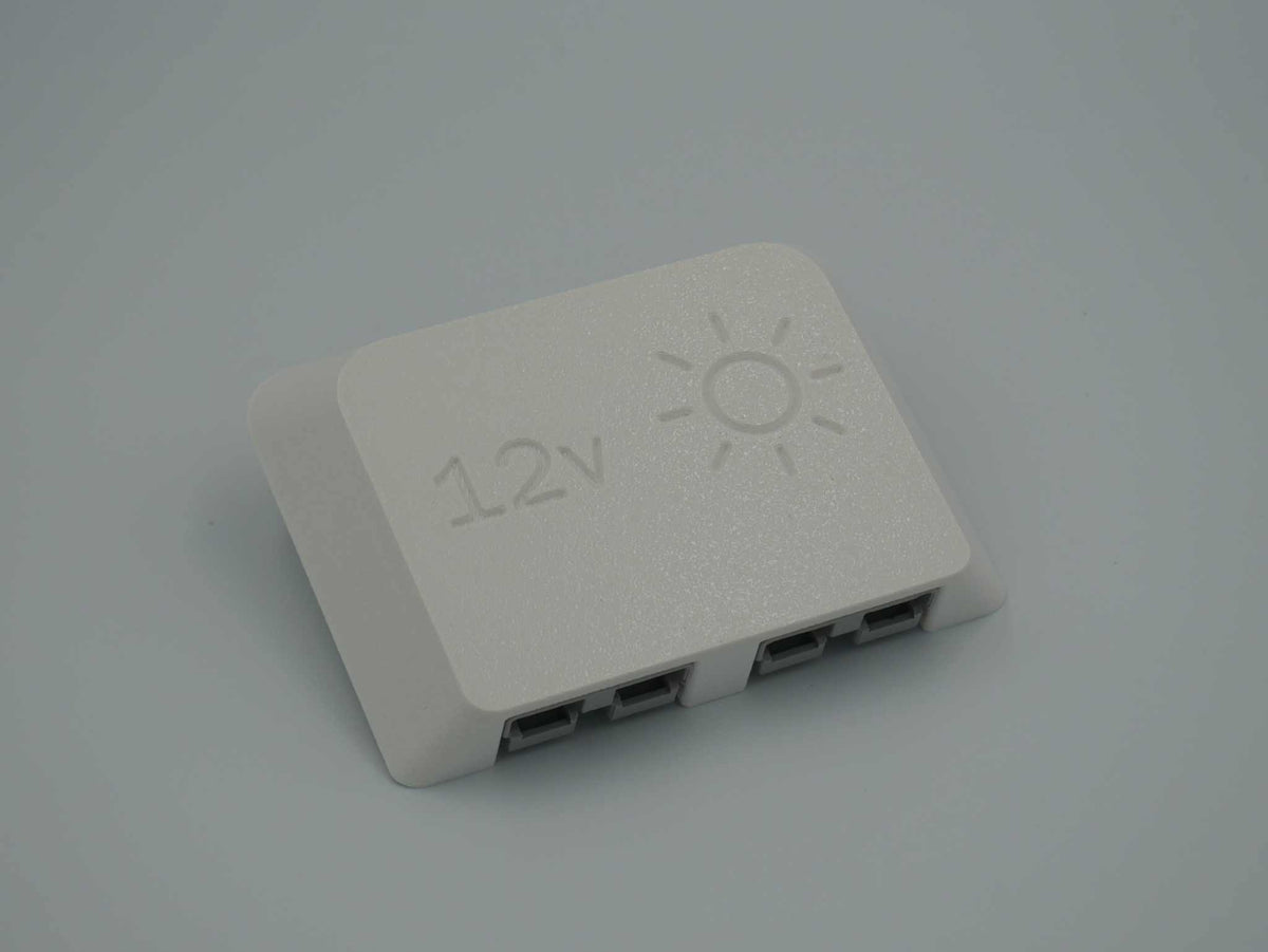 Dual Anderson Mount in white ASA-Glass Fibre with 12v text and sun icon printed on the top, for two 50amp Anderson plugs