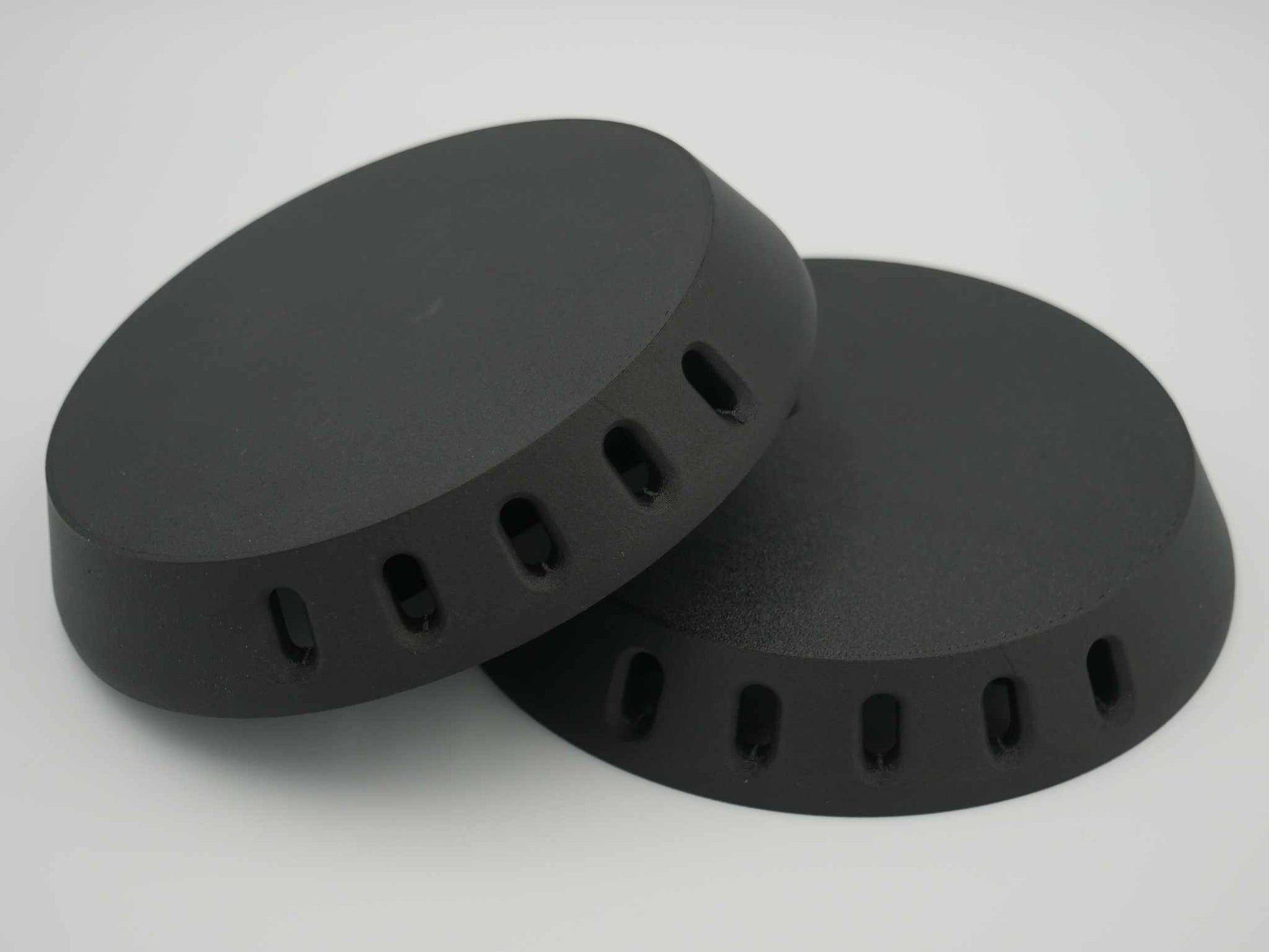 Pair of black circular canopy vents made from durable ASA-Carbon Fiber or ABS-Glass Fiber for Ute canopies