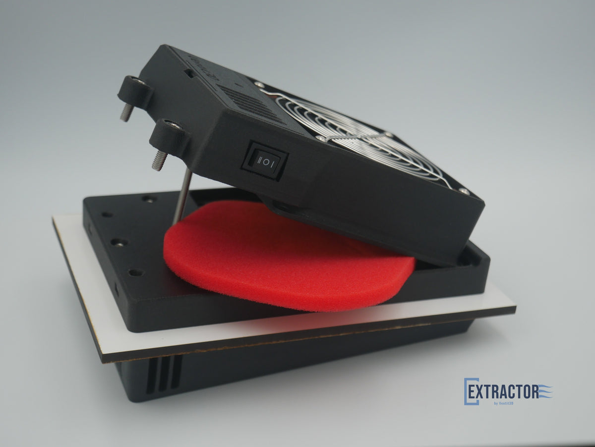 The Extractor fan box tilted up on its hinge, showing the three-way switch and the reusable red Uni foam filter