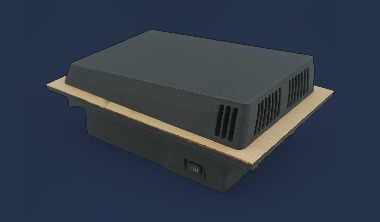 Low-profile outer housing of The Extractor with downward-facing louvres, fitted through a panel